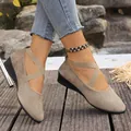Detailed view of khaki wedge shoes featuring cross straps and a soft matte finish - 36 / Gray
