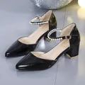 Elegant black block heel sandals featuring a stylish pearl ankle strap and pointed toe design - 34 / Black
