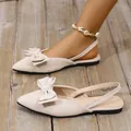 Elegant beige suede pointed-toe flat sandals with large bow detail and slingback strap - 35 / Off White