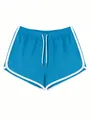 Dettaglio pantaloncini sportivi blu da donna con coulisse e profili bianchi - Celeste