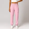Close-up of comfortable pink high-waisted joggers featuring a side zipper pocket detail - S / Bottoms / Pink