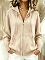 Detail shot of a beige oversized knit hoodie with a high-quality metal zipper and ribbed cuffs - S / Tops / Apricot