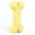 Yellow spiked bone-shaped dog toy made of durable TPR for dental cleaning and chewing - S / 6cm x 12cm / Macaron Yellow