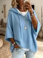 Pull à capuche bleu pour femme en maille gaufrée, coupe ample et texture confortable. - Bleu ciel