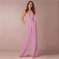 Elegant pink sleeveless halter neck jumpsuit featuring a deep V-neck and wide leg silhouette - S / Pink