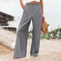Vue complète d'un pantalon gris taille haute à jambes larges pour femme sur une plage - S / Bas (1216#) / Gris