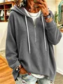 Close-up of gray waffle knit hoodie with white drawstring and zipper detail for casual look - Dark Gray