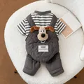 Detailed view of dog winter jumpsuit featuring 3D cartoon puppy head and quilted grey fabric - S / Charcoal Grey