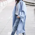 Detailed view of a light blue long woolen coat showing its soft textured fabric - S / Tops / Light Blue