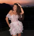 Detailed view of a French floral off-the-shoulder mini dress with tiered ruffle layers. - S / Dresses / Pink