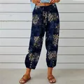 Detail view of high waist cotton linen trousers with retro floral print and drawstring - S / Bottoms / Navy Blue