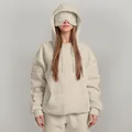Detail view of a beige oversized hoodie with a unique built-in eye mask for sleeping. - S / Tops / Apricot