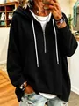 Detailed view of women's oversized black waffle knit hoodie with white drawstrings - Black