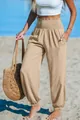 High-waisted smocked khaki beach joggers for women featuring elastic cuffs and pockets - Khaki