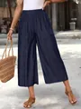Detailed view of navy blue wide-leg cropped pants with pockets and elastic waist - S / Bottoms / Navy Blue