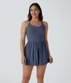 Full view of a stylish ladies sleeveless blue romper dress showing fit and fabric details - S / Dark Blue