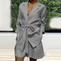 Detailed view of a grey casual two-piece suit set with a tie-waist blazer and matching shorts. - XL / Top And Bottom / Gray