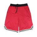 Detailed close-up showing breathable mesh fabric and striped trim on red athletic shorts - M / Bottoms / Red