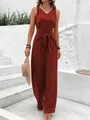 Chic rust red sleeveless V-neck wide-leg jumpsuit featuring a stylish waist tie-knot design - S / Dresses / Burgundy
