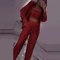 Detail view of the red sequin three-piece set featuring shirt, tube top, and pants - XS / Top And Bottom / Red