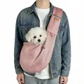 Detail view of pink breathable mesh pet sling carrier with a small white dog inside - Pink