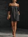 Detail of loose black cotton linen off-shoulder dress with puff sleeves on model. - S / Dresses / Black
