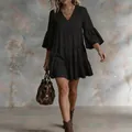 Elegant black tiered mini dress with bell sleeves for summer vacation styling - S / Dresses / Black