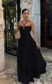 Elegant black pleated maxi dress with a sophisticated halter neckline and cutout details. - S / Dresses / Black
