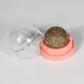 Natural catnip ball treat for cats with a pink rotating base and clear dust cover - Pink