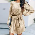 Detail of golden sequined cocktail dress with velvet waist belt for holiday parties - S / Dresses / Gold
