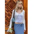 White crocheted hollow-out long sleeve cardigan with bow tie detail shown on model - S / Tops / White