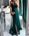 Detailed view of elegant dark green floor-length evening gown with high slit - S / Dresses / Green