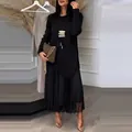 Elegant black long sleeve knit top with asymmetrical hem and matching pleated skirt set - S / Top And Bottom / Black