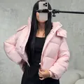 Stylish light pink short hooded puffer jacket for women featuring a cozy street style design - S / Tops / Pink