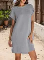 Detailed view of grey short sleeve dress with rolled cuffs and round neck on model - Light Gray