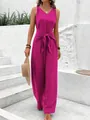 Stylish fuchsia V-neck sleeveless wide-leg jumpsuit with waist tie detail shown on model - Rose Red