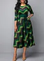 Detailed view of women's round neck dress with green zigzag print and high waist belt - M / Dresses / Green