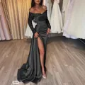 Elegant floor-length black evening gown with sequin sleeves and high leg slit detail - S / Dresses / Black