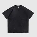 Camiseta negra lavada vintage en algodón pesado con rotos y corte holgado - S / Tops / Negro Lavado