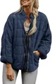 Detail view of a navy blue quilted jacket with a high stand collar and zip-up front. - Navy Blue