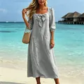 Elegant grey square-neck cotton linen dress with bow detail in a sunny tropical beach setting - S / Dresses / Light Gray