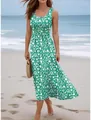 Green floral sleeveless maxi dress for summer beach vacation shown in a seaside setting - S / Dresses / Cyan