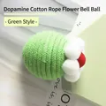 Pet cat toy ball made of green woven cotton rope with a white plush flower detail - Single Piece / Green