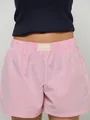 Close-up of pink and white striped high-waisted shorts with elastic waistband and blank tag. - XS / Bottoms / Pink Stripe