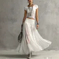 Close-up detail of the elegant white knit top paired with a flowy chiffon maxi skirt - XS / Top And Bottom / White