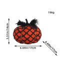 Handmade knitted Halloween pumpkin ornament in orange and black lattice with feathers - Orange Pumpkin