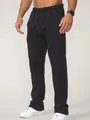Detailed view of men's loose black fitness sweatpants with drawstring waist - S / Bottoms / Black