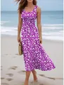 Detailed shot of woman wearing purple floral print sleeveless maxi dress on a beach - S / Dresses / Purple