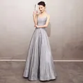 Full length view of an elegant silver glittery spaghetti strap evening gown for formal events - S / Dresses / Silver