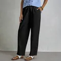 Women's black cotton linen drawstring casual pants with pockets and button hem - S / Bottoms / Black
